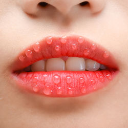 Cropped image of woman with wet lips