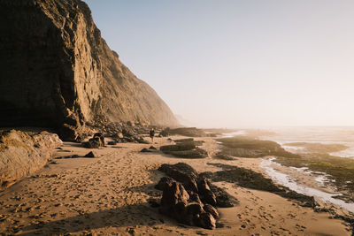 Scenic view of beach against clear sky