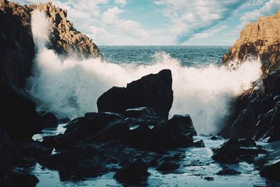 View of waves breaking on coast