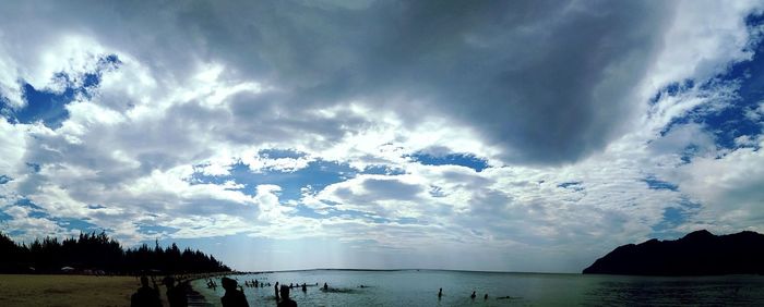 Panoramic view of sea against storm clouds