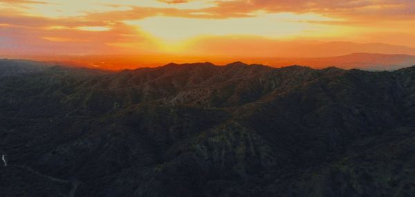 Scenic view of mountains against sky during sunset