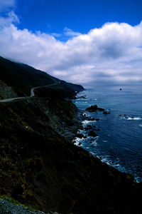 Scenic view of sea against cloudy sky