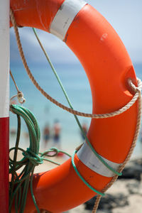 Close-up of rope against orange water