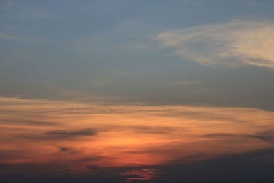 Low angle view of dramatic sky during sunset