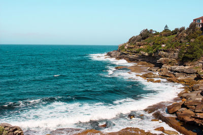 Scenic view of sea against clear blue sky