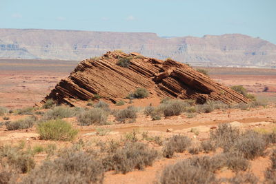 Scenic view of arid landscape against sky