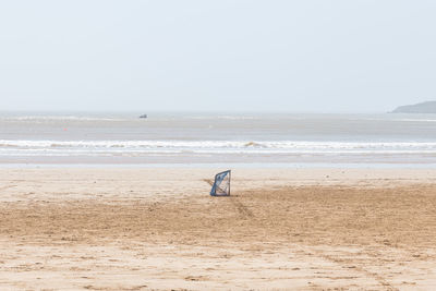 Scenic view of beach against clear sky