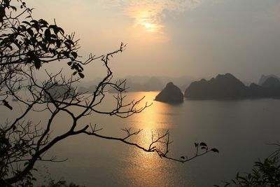 Scenic view of lake at sunset