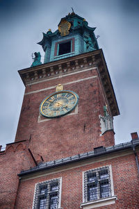 Low angle view of clock tower against sky