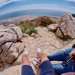 Low section of people on rocks