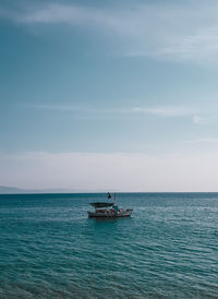 Boat in sea against sky