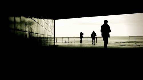 Silhouette people on beach