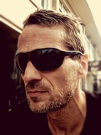 Close-up portrait of man wearing sunglasses