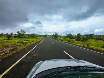 Road seen through car windshield