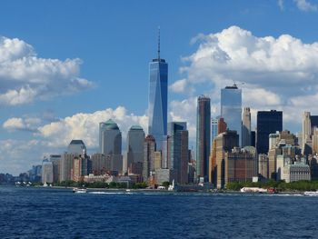 City skyline against cloudy sky