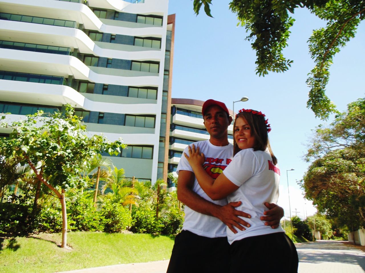 love, togetherness, two people, heterosexual couple, happiness, bonding, building exterior, adults only, tree, men, smiling, plant, young adult, young women, outdoors, day, women, architecture, adult, people