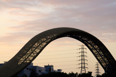 Low angle view of silhouette bridge against sky during sunset