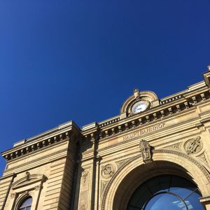 Low angle view of built structure against clear blue sky