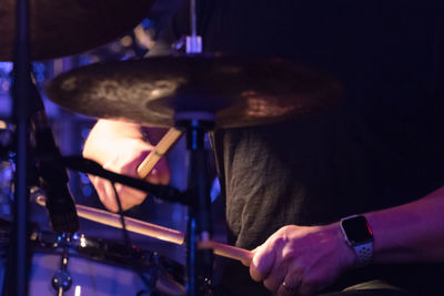 Close-up of man playing piano