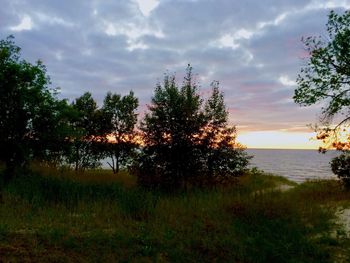 Scenic view of lake against sky during sunset