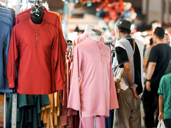 Rear view of people walking in store