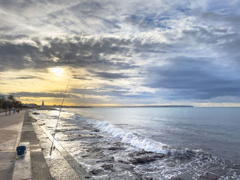 Early morning sunrise, molinar in palma mallorca spain, with iridescent light coming off the waves