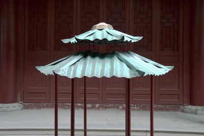 Umbrella on roof of building during winter