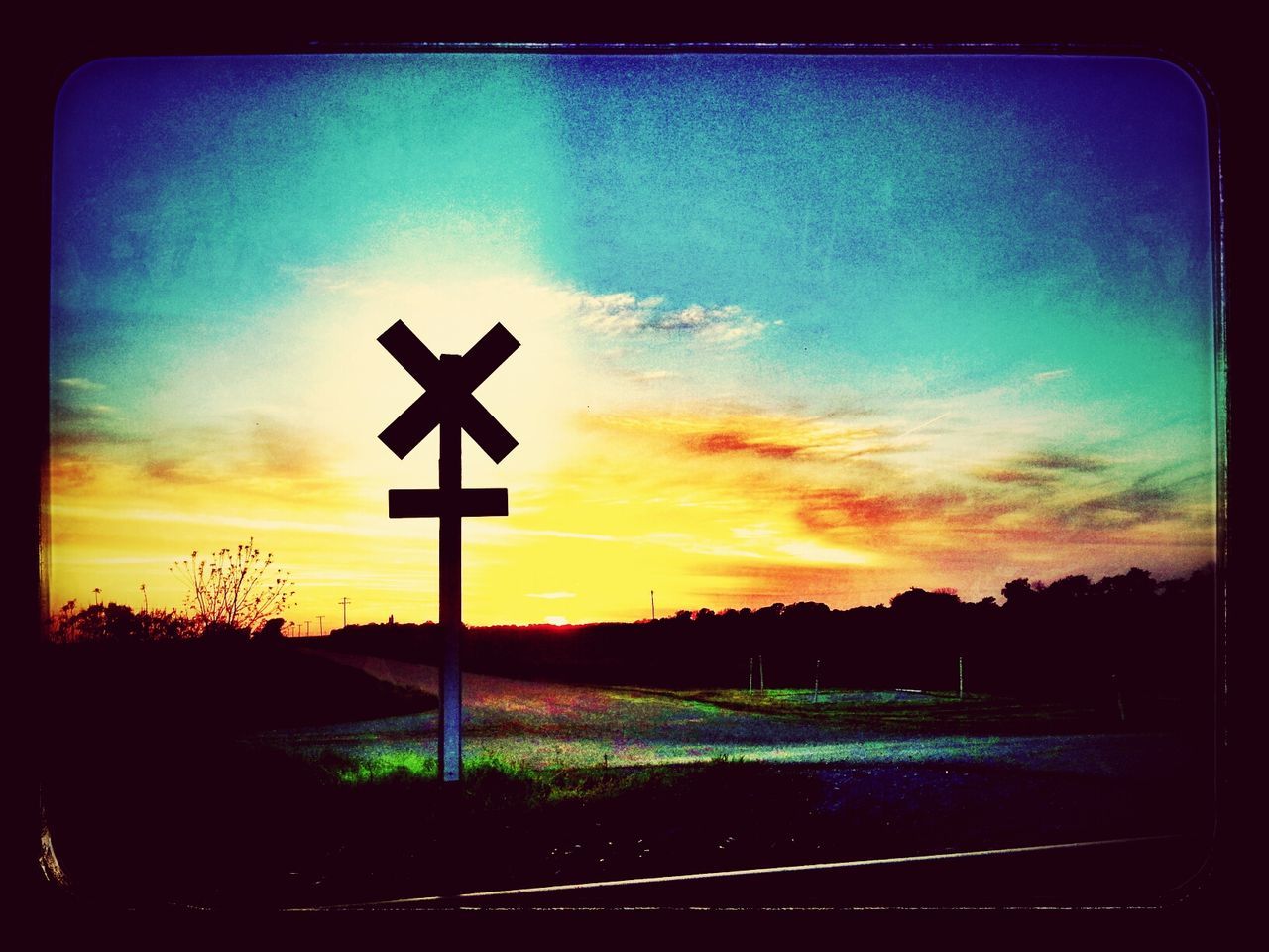 sunset, transfer print, silhouette, sky, auto post production filter, landscape, orange color, tranquility, field, cross, tree, scenics, cloud - sky, tranquil scene, religion, nature, beauty in nature, cloud, road sign, blue