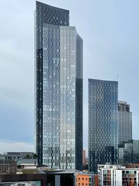 Low angle view of modern buildings against sky