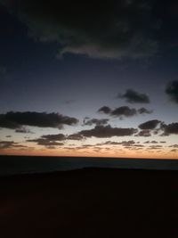 Scenic view of silhouette landscape against sky at sunset