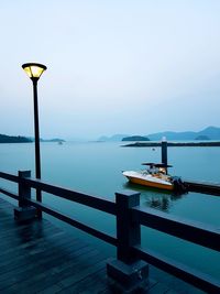Pier on sea against clear sky