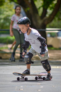 High angle view of boy riding skateboard