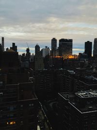 High angle view of buildings in city against sky