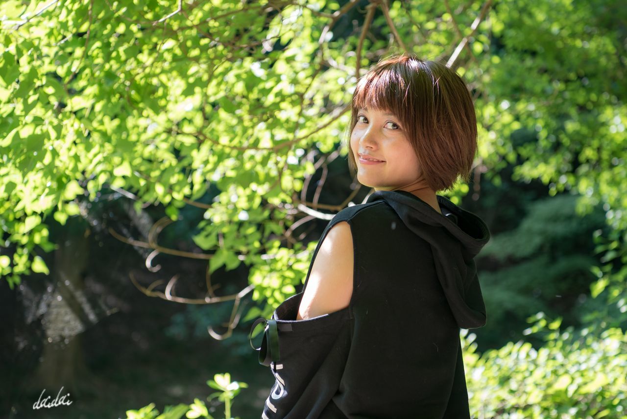 one person, real people, childhood, standing, tree, outdoors, day, focus on foreground, leisure activity, green color, bangs, nature, growth, lifestyles, people