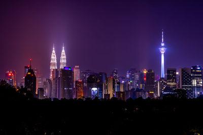 Illuminated buildings in city at night