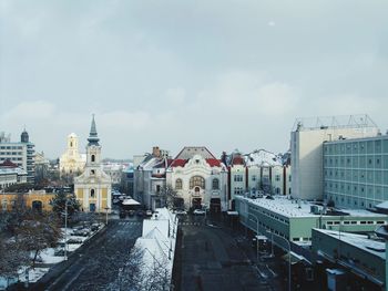 High angle view of buildings in city during winter