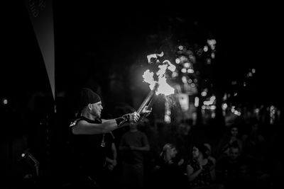 People playing guitar at music concert