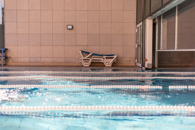 Chairs by swimming pool