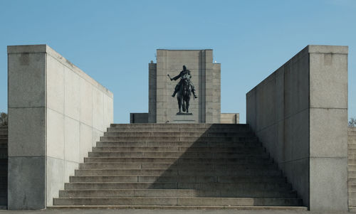 Low angle view of statue against sky
