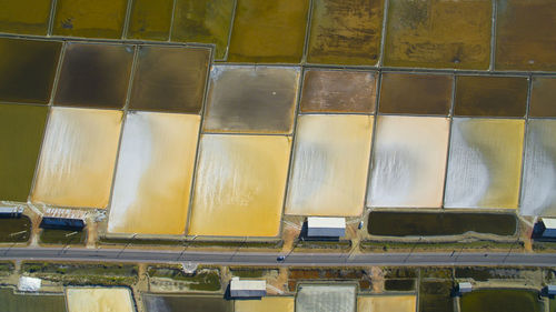 High angle view of yellow container on glass