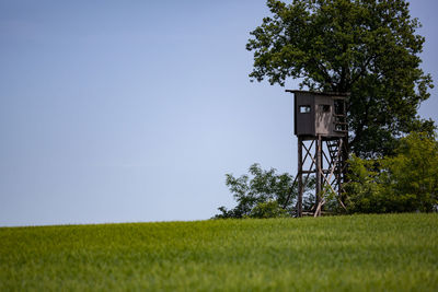 Scenic view of field against clear sky