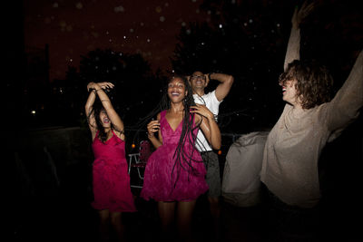 Group of people in traditional clothing during night