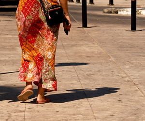 Low section of woman standing on street