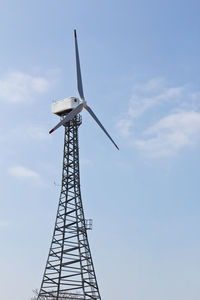 Low angle view of windmill against sky