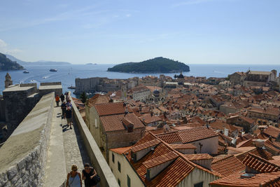 High angle view of city buildings against sky