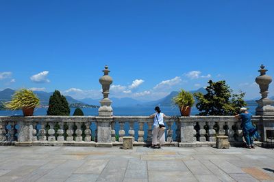 Statue of historic building against blue sky