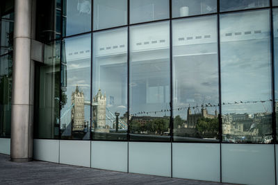 Reflection of building on glass window