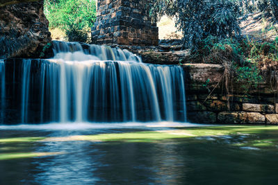 Scenic view of waterfall in forest