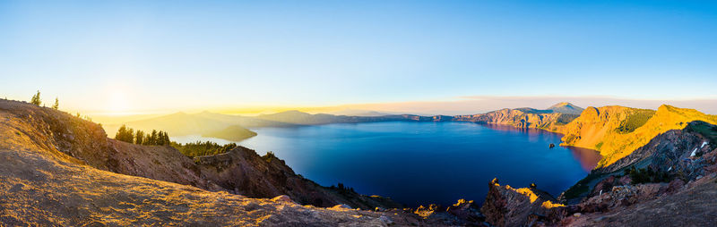 Panoramic view of lake against sky during sunset