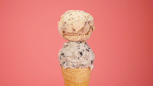 Close-up of ice cream against red background